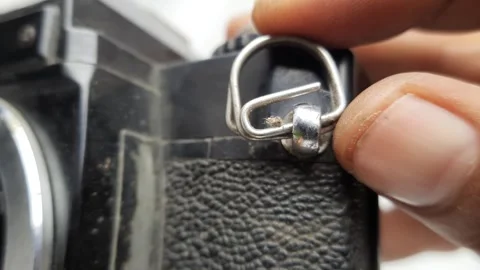 Macro Hand Touching Camera Strap Attachment Ring Stock Footage 310176205