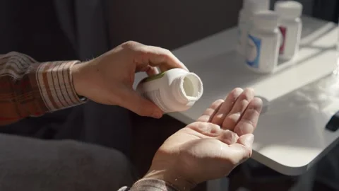 Macro Hands With Assorted Pills Drinking Water Stock Footage 330092510