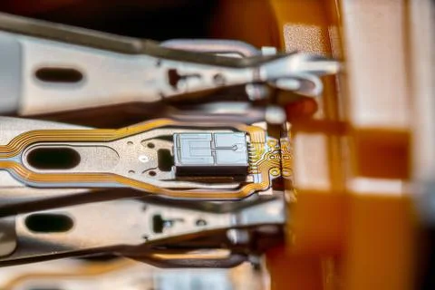 Macro hard disk drive HDD head. Stock Photos