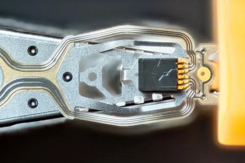 Macro hard disk drive HDD head. Stock Photos