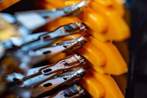 Macro hard disk drive HDD head. Stock Photos