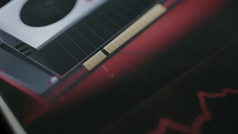 Macro hardware dashboard pairs a partial graphics card view Stock Footage 342487567