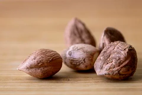 Macro hazelnut on wooden table Stock Photos