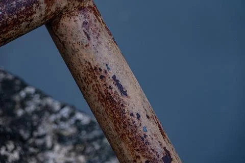 Macro of heavy raw metal rust texture at twilight on pipe Stock Photos