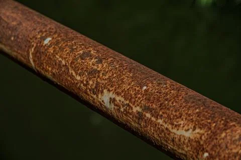 Macro of heavy rust texture on industrial iron pipe near midnight Stock Photos