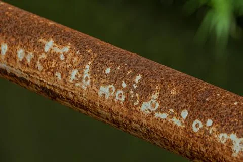 Macro of heavy rust texture on industrial iron pipe near midnight Stock Photos