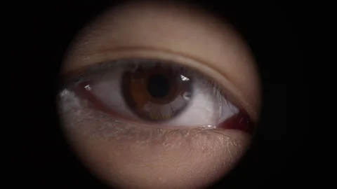 Macro Of A Human Eye Wide Open Behind Black Hole. Close up Stock Footage 243905623