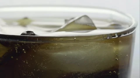 Macro ice drop in soda then pan to white Stock-Footage 68002802