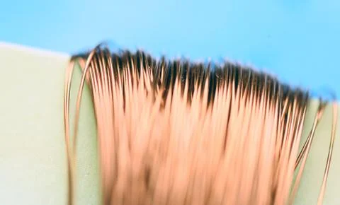 Macro image of copper wire with a defocused background highlighting the fragi Stock Photos