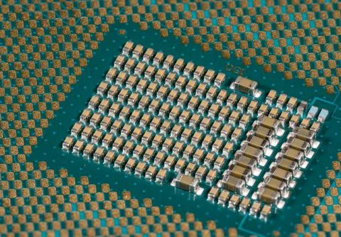 Macro image of the CPU in a modern PC with components and connections Stock Photos