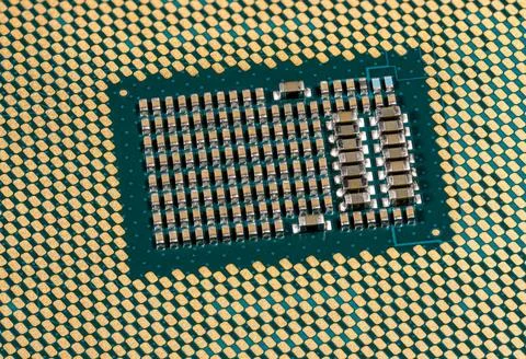 Macro image of the CPU in a modern PC with components and connections Macr... Stock Photos