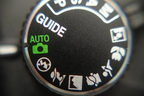 Macro image of a digital camera s controls set on auto Macro image of a di... Stock Photos