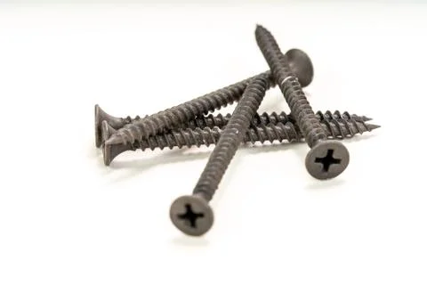 Macro image of Drywall screws on white background. Stock Photos