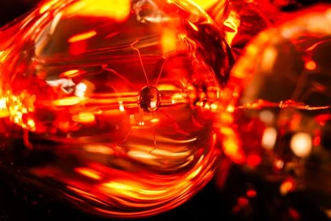 Macro image of edison light bulb in strikingly warm light Stock Photos