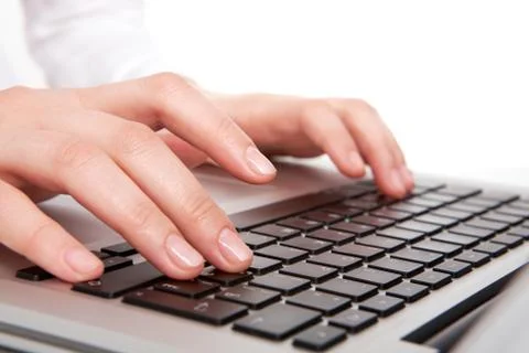 Macro image of human hands typing on keyboard Stock Photos