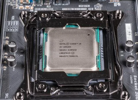 Macro image of Intel Core i9 CPU chip installed on modern motherboard Stock Photos