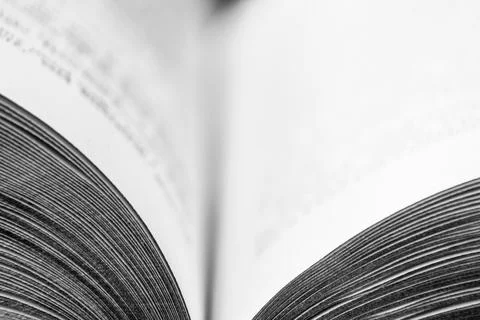 Macro image of open book with hint of printing and very limited focus Stock Photos