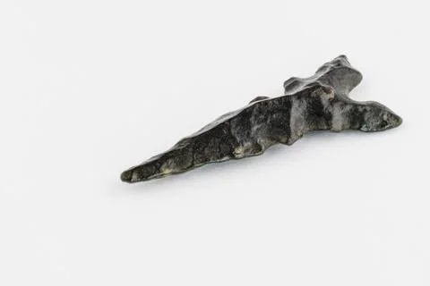 Macro image of an original arrowhead from the Paleolithic Age Stock Photos