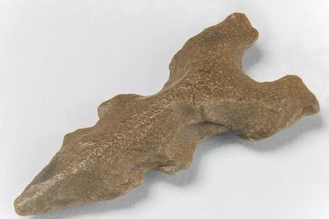Macro image of an original arrowhead from the Paleolithic Age Stock Photos