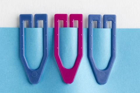 Macro image of plastic paperclip on note Stock Photos