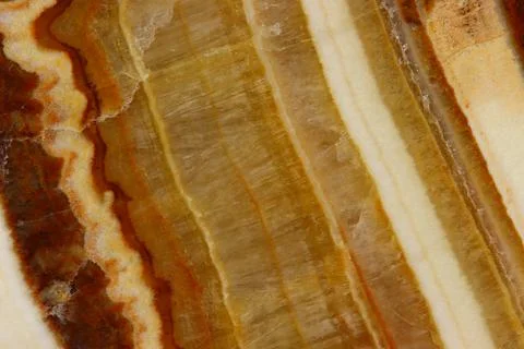 The macro image of the polished natural marble stone Onyx. Stock Photos