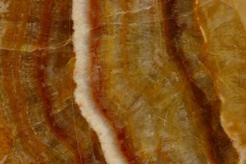 The macro image of the polished natural marble stone Onyx. Stock Photos