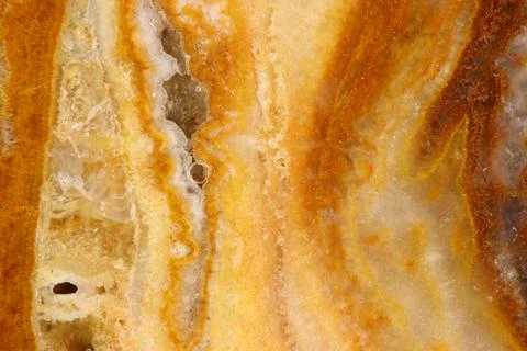 The macro image of the polished natural marble stone Onyx. Stock Photos