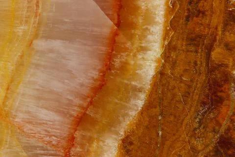 The macro image of the polished natural marble stone Onyx. Stock Photos