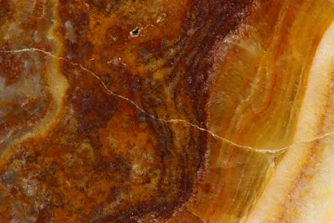 The macro image of the polished natural marble stone Onyx. Stock Photos