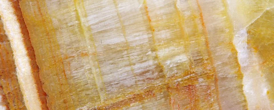The macro image of the polished natural marble stone Onyx. Stock Photos