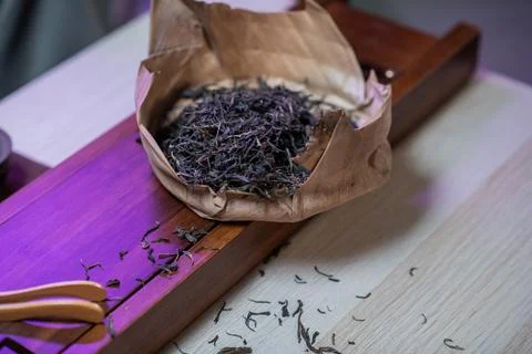 Macro image of raw aged Chinese tea leaves on the counter of a tea shop Stock Photos