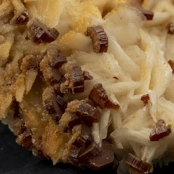 Macro image of red crystals of vanadinite on barite Stock Photos