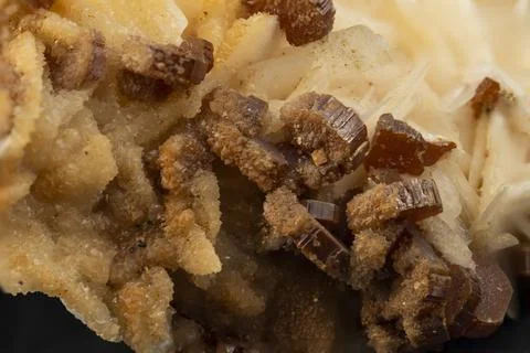 Macro image of red crystals of vanadinite on barite Stock Photos