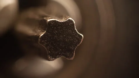 Macro image of a rotating Torx bit on a power screwdriver. Close-up Stock Footage 303112735
