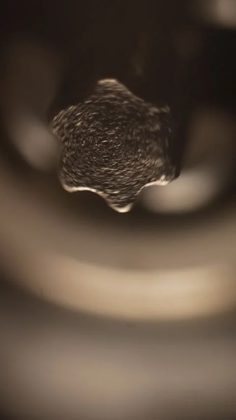 Macro image of a rotating Torx bit on a power screwdriver.special screw tip used Stock Footage 303691534