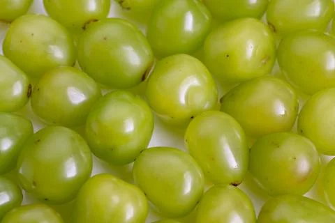 Macro image showcasing vibrant grapes creating organic repeating pattern, H.. Stock Photos