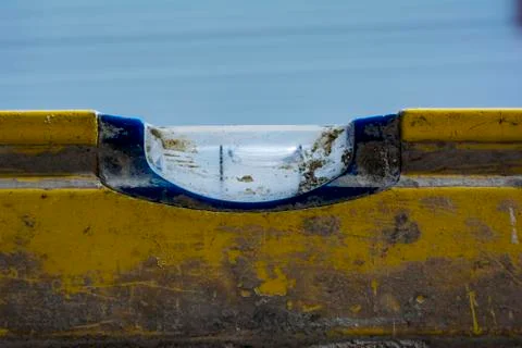 Macro image of a used and dirty spirit level on a concrete wal Stock Photos