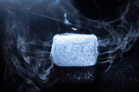 Macro image of vaporizing dry ice crystal Stock Photos