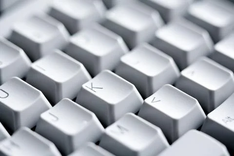 Macro image of white buttons of computer keypad with letters and symbols on.. 写真素材