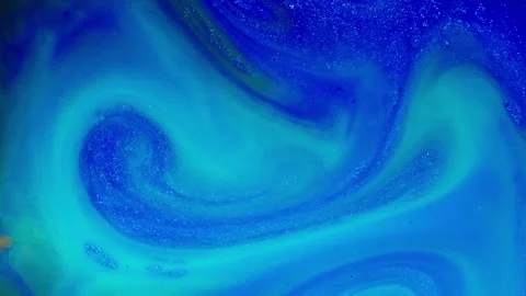 Macro ink swirl with glowing blue liquid movement in a dreamy and surreal Stock Footage 307895914