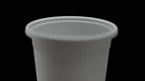 Macro, the inner face of an ecological cornstarch cup on a black background Stock Footage 171942614