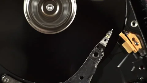Macro of the inside of a working hard drive disk accessing data Stock Footage 206147809