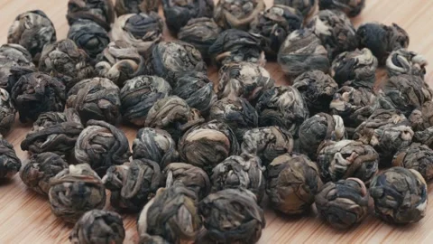 Macro of jasmine green tea balls Stock Footage 281512663
