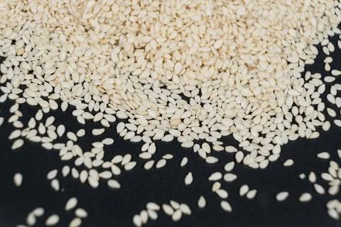 Macro kernels of white roasted sesame seeds. Stock Photos