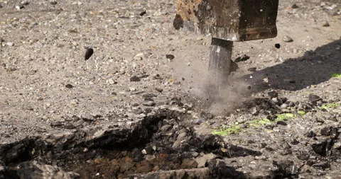 Macro of laborer worker drilling concrete asphalt with jackhammer bit Stock Footage 268211788