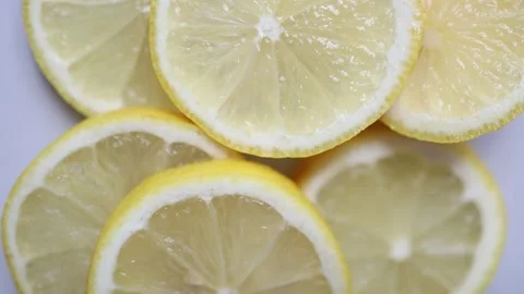 Macro lemon slices with juicy pulp and bright fresh citrus texture Vídeos de archivo 344044021