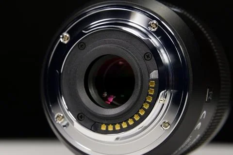 Macro lens mount for Micro Four Thirds camera MFT isolated close-up on black Stock Photos