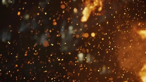Macro-lens view of a fiery explosion, showcasing bright golden sparks Stock Footage 340318448