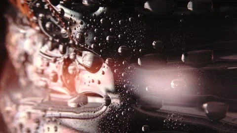 Macro level view of water sweat water beads in bottle bright light Stock Footage 234514162