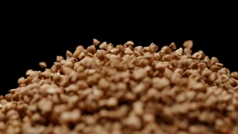 MACRO: Light explosion of buckwheats on a black background - Slow motion Stock Footage 91173016